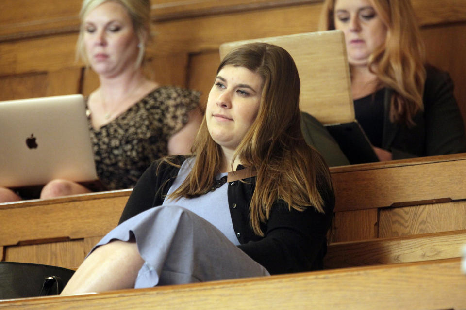 Brittany Jones, lobbyist and policy director for Kansas Family Voice, a conservative group pushing to roll back transgender rights, watches a Senate session from the chamber's west gallery, Tuesday, April 4, 2023, at the Statehouse in Topeka, Kan. Kansas lawmakers have approved a bill that would prevent transgender people from changing their driver's licenses and using restrooms, locker rooms and other facilities associated with their gender identities. (AP Photo/John Hanna)