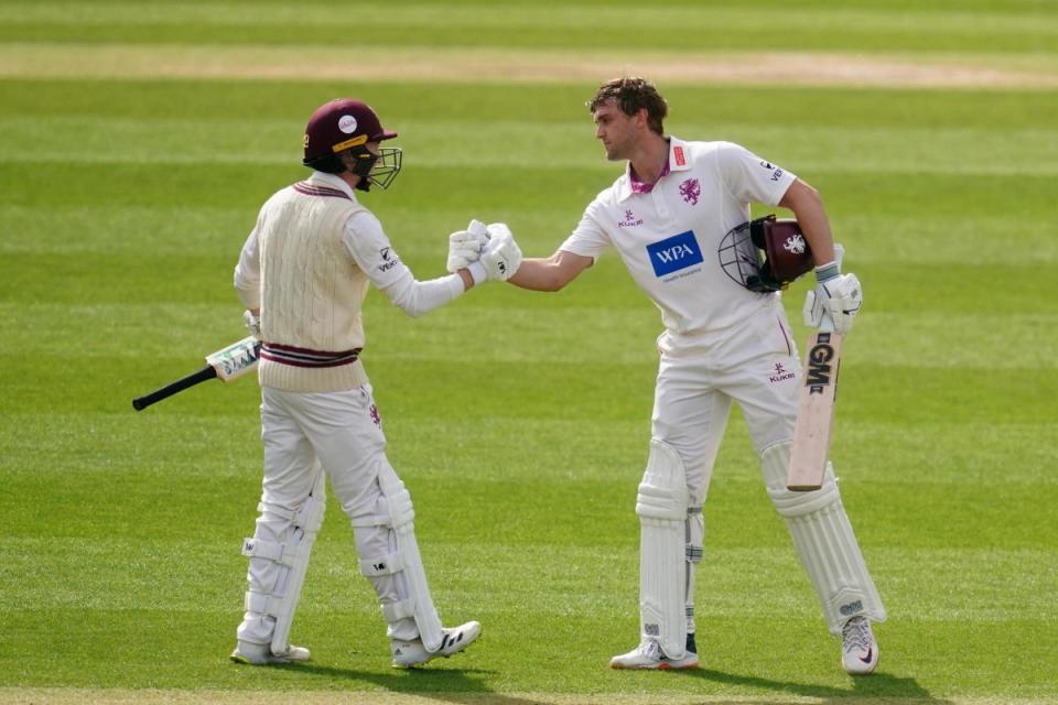 Tom Lammonby celebrates his century with Lewis Goldsworthy <i>(Image: Adam Davy/PA Wire)</i>