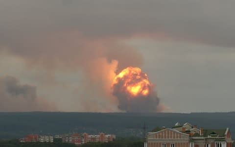 Flame and smoke rising from the site of blasts at an ammunition depot near the town of Achinsk in Krasnoyarsk region, Russia August 5, 2019 - Credit: DMITRY DUB/&nbsp;REUTERS