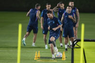 Lionel Messi warms up during Argentina official training on the eve of the group C World Cup soccer match between Argentina and Mexico, in Doha, Qatar, Friday, Nov. 25, 2022. (AP Photo/Jorge Saenz)