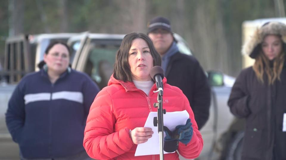 Amy McClintock, a Whitehorse engineer, speaks at a vigil on Dec. 6, 2023, to mark the National Day of Remembrance and Action on Violence Against Women.