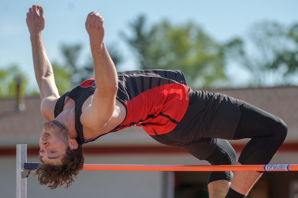 Metamora's Nick Walker clears the bar in the high jump during the Mid-Illini Championship track and field meet Tuesday, May 7, 2024 at Carper Field in Morton. Walker won the event with a jump of 1.98 meters.