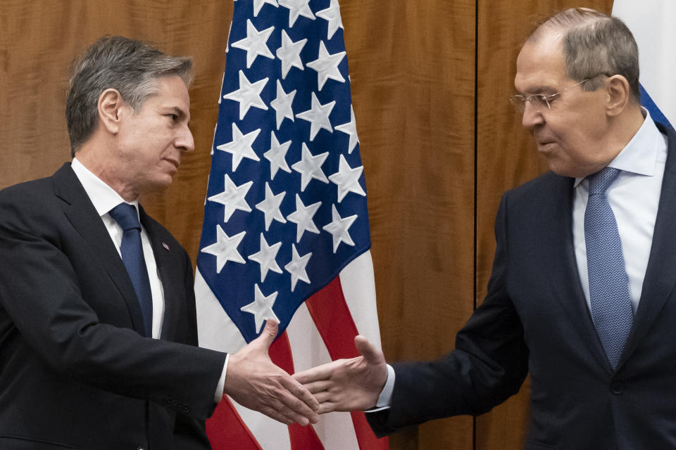 FILE - Secretary of State Antony Blinken, left, greets Russian Foreign Minister Sergey Lavrov before their meeting, Friday, Jan. 21, 2022, in Geneva, Switzerland. With tens of thousands of Russian troops positioned near Ukraine, the Kremlin has kept the U.S. and its allies guessing about its next moves in the worst security crisis to emerge between Moscow and the West since the Cold War. (AP Photo/Alex Brandon, Pool, File)