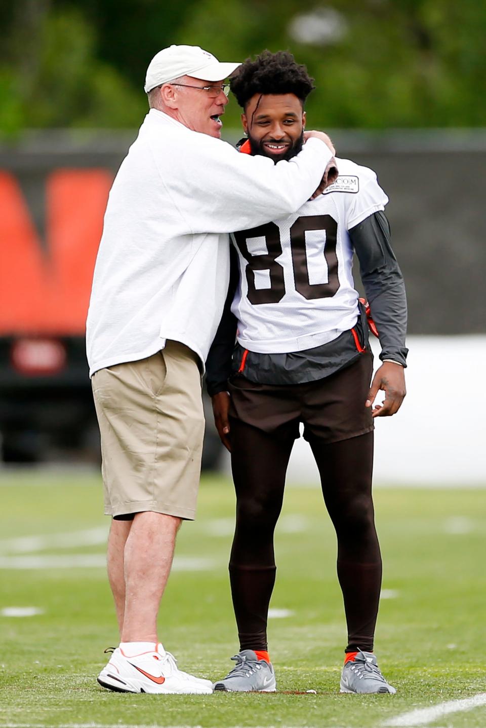 Browns wide receiver Jarvis Landry gets a hug from general manager John Dorsey at the team's NFL football training facility in Berea, Tuesday, June 4, 2019. (AP Photo/Ron Schwane)