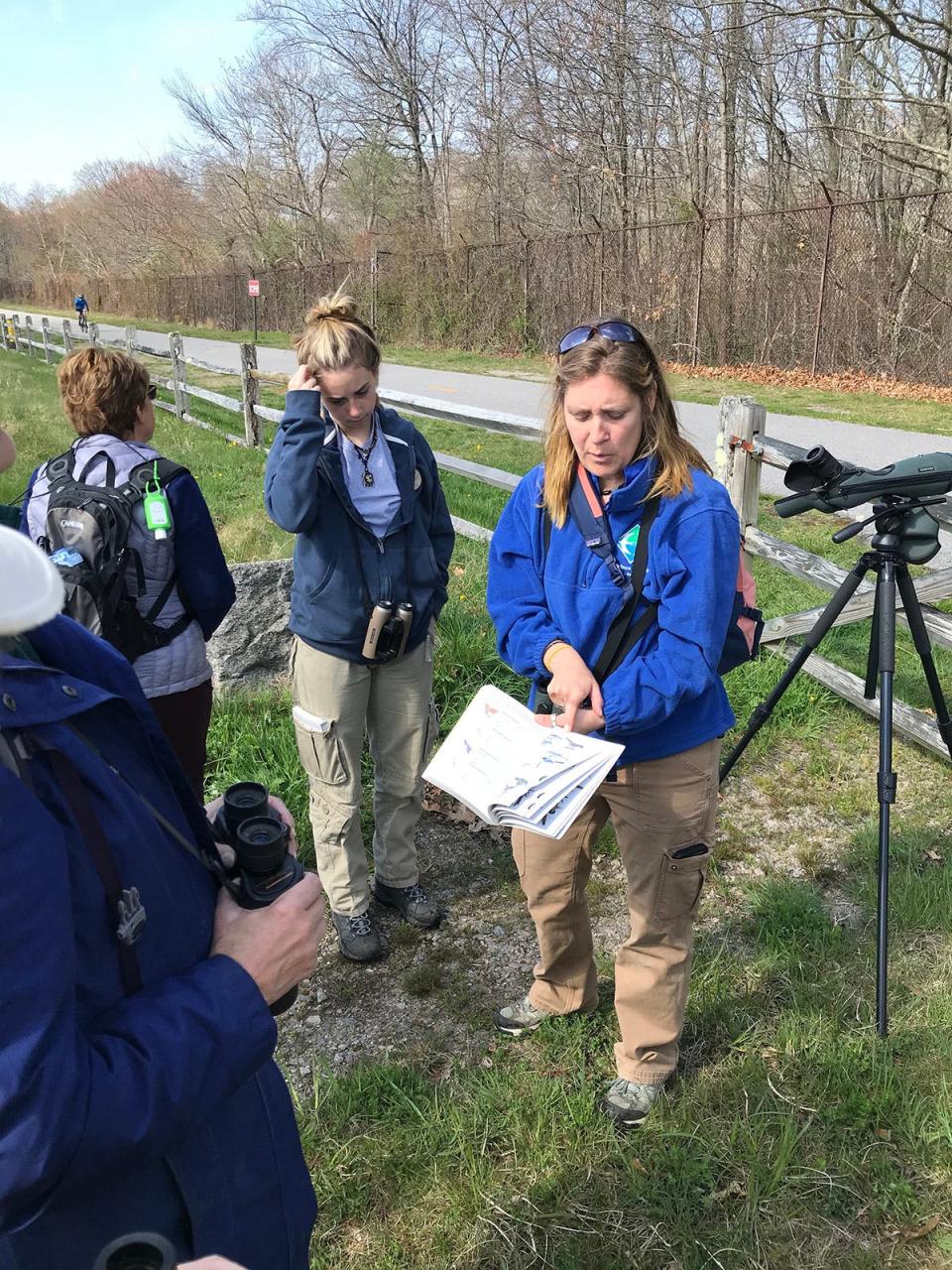 Laura Carberry, a guide for the Audubon Society of Rhode Island, leads a group bird walk at Calf Pasture Nature Area, a prime spot for many species.