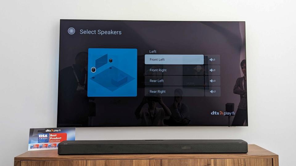 A DTS Play-Fi TV showing a spekaer highlighted on the screen and a list of options to select which speaker it is
