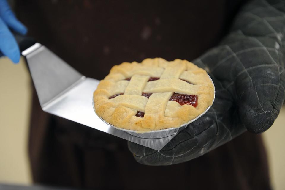 At Dulce D Leche in Ashland,  a just out of the oven strawberry rhubarb pie in the hands of owner Jules Remenar,  March 10, 2022.