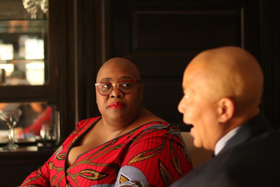 Adriane Johnson-Williams listens as her wife describes her prom experience from her childhood as the couple prepared to leave for OUTMemphis' Queer Prom.