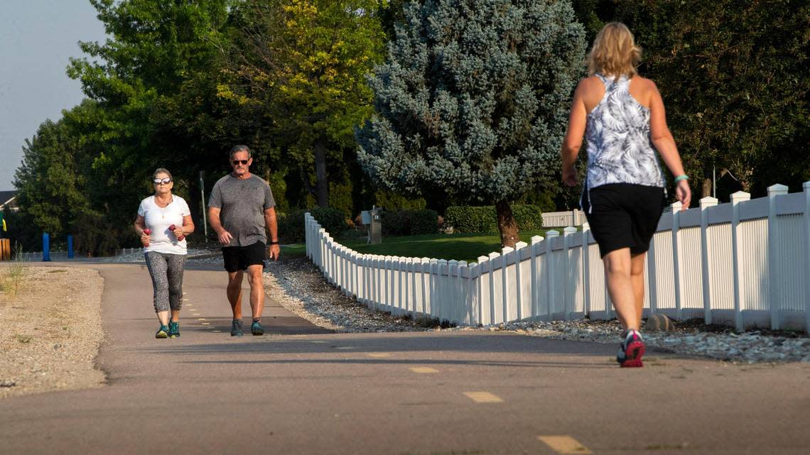 Meridian residents walk along the Five Mile pathway near the Bridgetower subdivision. Meridian has 50 miles of trails like the Five Mile pathway.