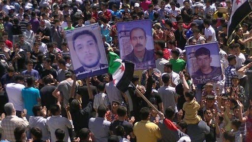 Picture from the Syrian opposition's Shaam News Network April 13, shows a demonstration against Syrian President Bashar al-Assad in the town of Daraa. AFP is using pictures from alternative sources as it was not authorised to cover this event and is not responsible for alterations that cannot be independently verified