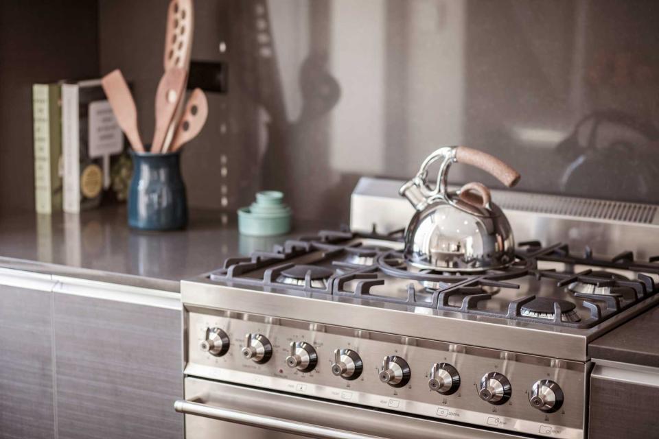 Kettle on stainless steel stove in modern kitchen