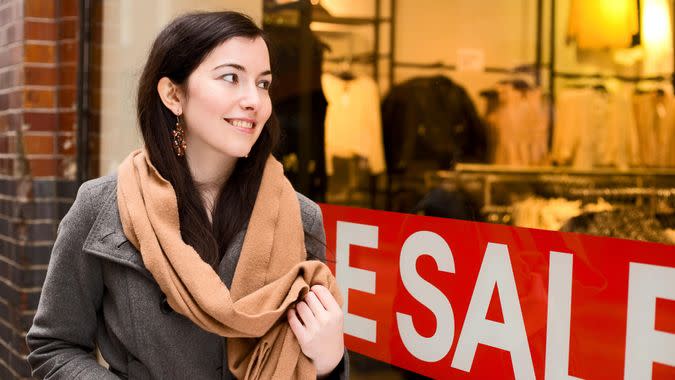 woman looking at sale while shopping