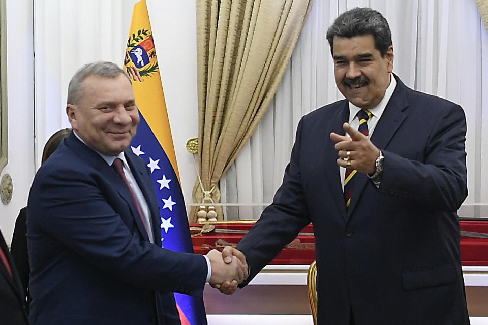 Russia's Deputy Prime Minister Yuri Borisov, left, and Venezuela's President Nicolas Maduro, shake hands during a media presentation at the Presidential Palace in Caracas, Venezuela, Wednesday, Feb. 16, 2022. Venezuelan and Russian officials met for high-level discussions in the South American country Wednesday, a day after diplomats from the U.S. and several other nations gathered to discuss steps toward a negotiated solution to the country’s protracted crisis. (AP Photo/Matias Delacroix)