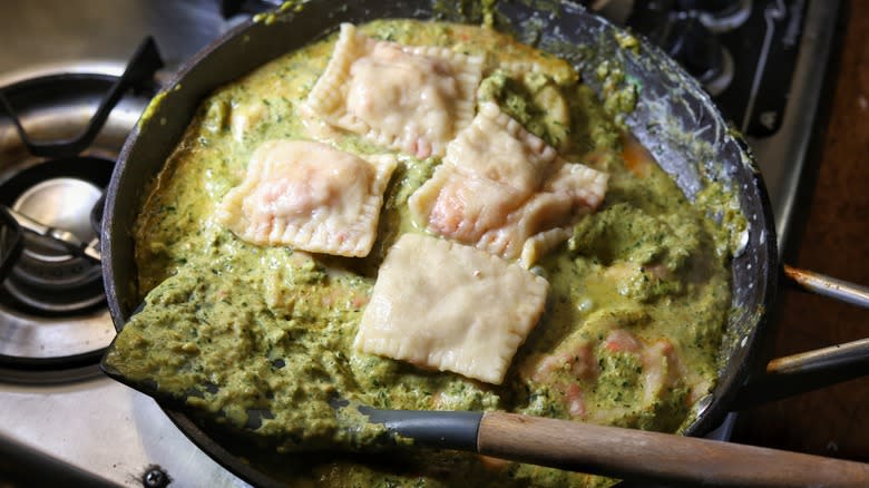 skillet of ravioli and sauce