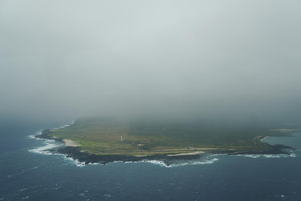 Clouds from a passing storm cover the peninsula of Kalaupapa, Hawaii, on Wednesday, July 19, 2023. A pilgrimage to the Kalaupapa settlement is logistically challenging since this beautiful and haunting slice of northern Molokai is defined by its natural isolation. (AP Photo/Jessie Wardarski)