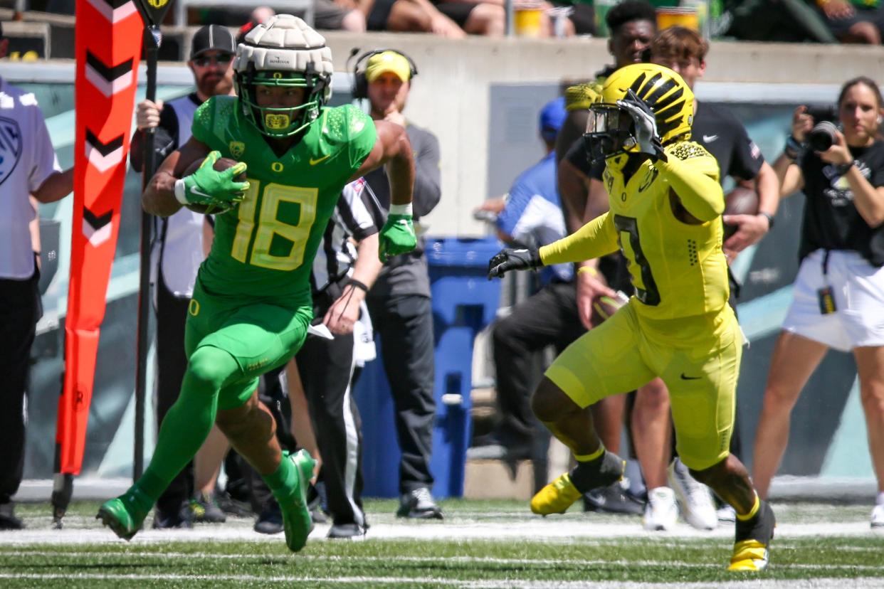 Green Team tight end Kenyon Sadiq carries the ball as the Oregon Ducks host their annual spring game at Autzen Stadium Saturday, April 29, 2023, in Eugene, Ore. 