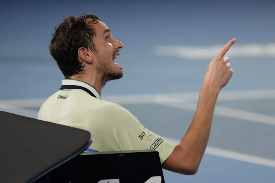 Daniil Medvedev of Russia gestures as he talks to chair umpire John Blom during his men's singles final match against Rafael Nadal of Spain at the Australian Open tennis championships in Melbourne, Australia, Sunday, Jan. 30, 2022. (AP Photo/Simon Baker)