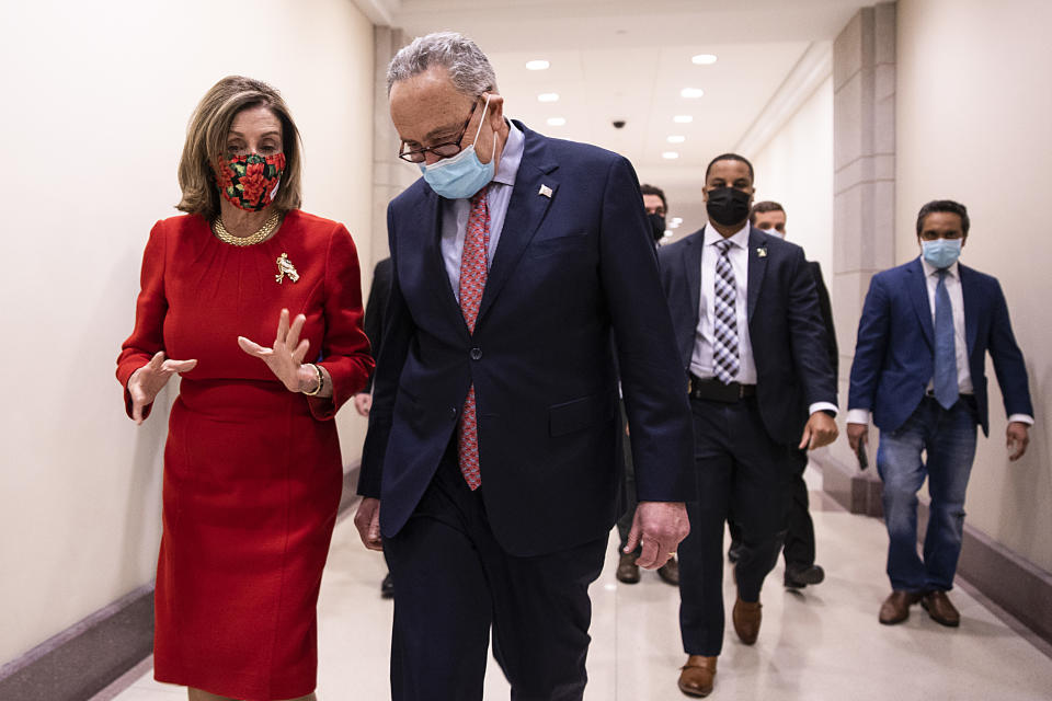 WASHINGTON, DC - DECEMBER 20: Speaker of the House Nancy Pelosi (D-CA) and Senate Minority Leader Chuck Schumer (D-NY) speak after a press conference on Capitol Hill on December 20, 2020 in Washington, DC. Republicans and Democrats in the Senate finally came to an agreement on the coronavirus relief bill and a vote is expected on Monday. (Photo by Tasos Katopodis/Getty Images)