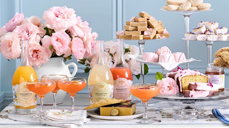 table set up with drinks and desserts for a party