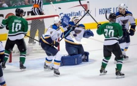 May 1, 2016; Dallas, TX, USA; Dallas Stars left wing Patrick Sharp (10) and center Cody Eakin (20) and St. Louis Blues defenseman Carl Gunnarsson (4) and goalie Brian Elliott (1) and defenseman Kevin Shattenkirk (22) look for the puck in midair during the overtime period in game two of the first round of the 2016 Stanley Cup Playoffs at the American Airlines Center. Jerome Miron-USA TODAY Sports