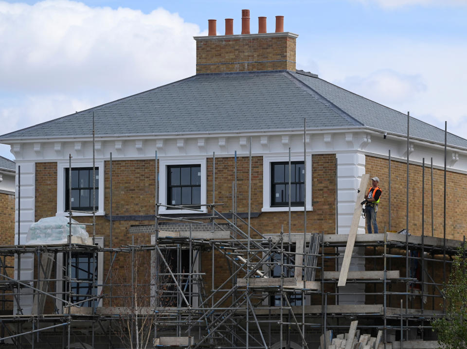 mortgage  A builder removes scaffolding from a new property in the planned community of Poundbury, built on land owned by, and with the design approved by Britain's Prince Charles, on the outskirts of Dorchester, Britain, August 19, 2022. REUTERS/Toby Melville