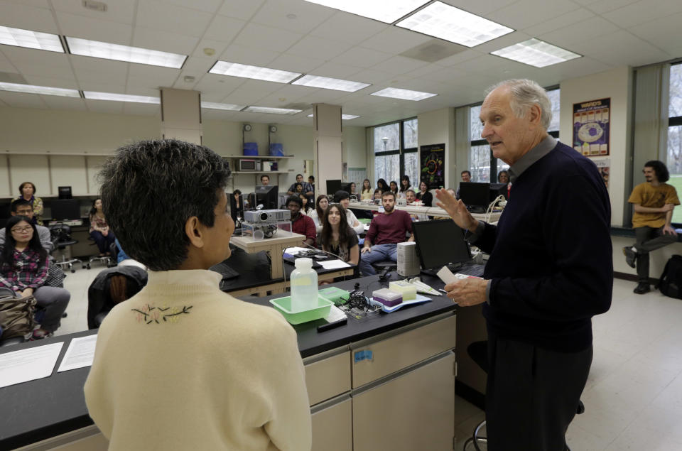 In this Friday, April 26, 2013 photo, actor Alan Alda enlists the help of Sujata Pawagi during a Communicating Science class on the campus of Stony Brook University, on New York's Long Island. The film and television star is trying to encourage scientists of all disciplines to ditch the jargon and speak in plain English. (AP Photo/Richard Drew)