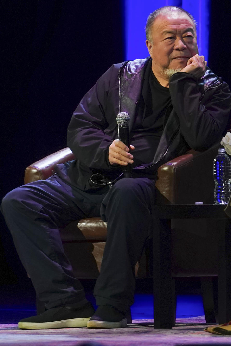 Visual artist and activist Ai Weiwei listens as he appears on stage with author Mira Jacob at The Town Hall theatre, Tuesday, Jan. 23, 2024, in New York. Ai was in New York to discuss his new book, the graphic memoir “Zodiac,” structured around the animals of the Chinese Zodiac, with additional references to cats. (AP Photo/Bebeto Matthews)