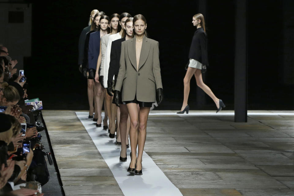 Models parade at the conclusion of the Theyskens Theory Fall 2013 runway show at Fashion Week in New York, Monday, Feb. 11, 2013. (AP Photo/Kathy Willens)