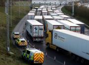 FILE PHOTO: Freight vehicles line up prior to boarding a train to France via the Channel Tunnel, amid the coronavirus disease (COVID-19) outbreak, in Folkestone