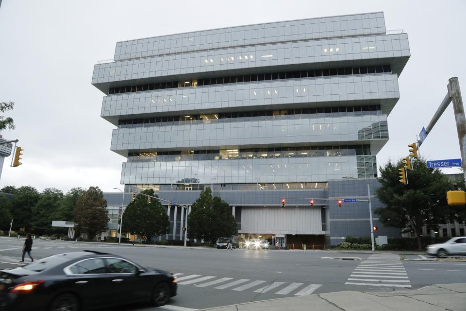 FILE - In this Sept. 12, 2019, file photo cars pass Purdue Pharma headquarters in Stamford, Conn. OxyContin maker Purdue Pharma launched an ad campaign Monday, Feb. 24, 2020, to tell people harmed by their powerful prescription opioid where they can file claims against the company. (AP Photo/Frank Franklin II, File)