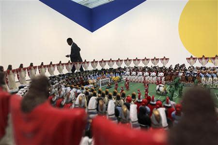 Curator Franklin Sirmans walks past "Maracana" by Nelson Leirner, based on Maracana Stadium in Brazil, during construction of the exhibition, "Futbol: The Beautiful Game", at the Los Angeles County Museum of Art (LACMA) in Los Angeles, California, January 27, 2014. REUTERS/David McNew