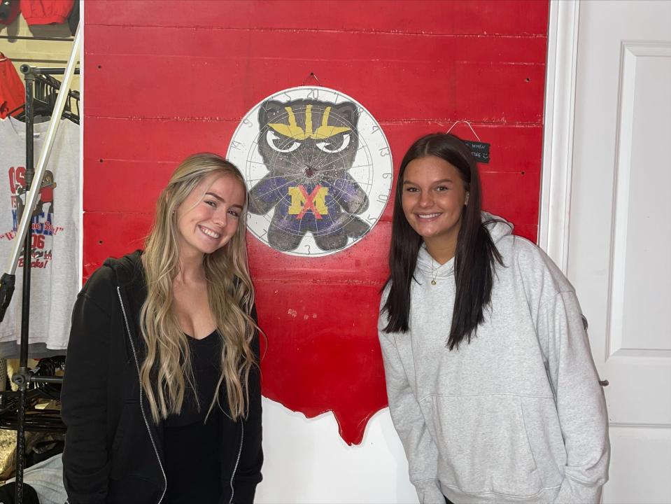 Madison Chiarini, left, a junior studying hospitality management, and Molly Bingham, a junior studying communications, both work at Around the Block, a clothing store with a focus on making college apparel more affordable for students. Chiarini and Bingham plan to hang out on High Street and ESPN's College GameDay.