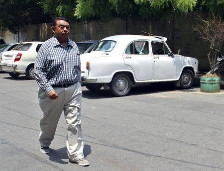 Ketan Desai, the former president of the Medical Council of India, walks after his hearing outside a courthouse in Lucknow, India, June 27, 2015. REUTERS/Pawan Kumar/Files