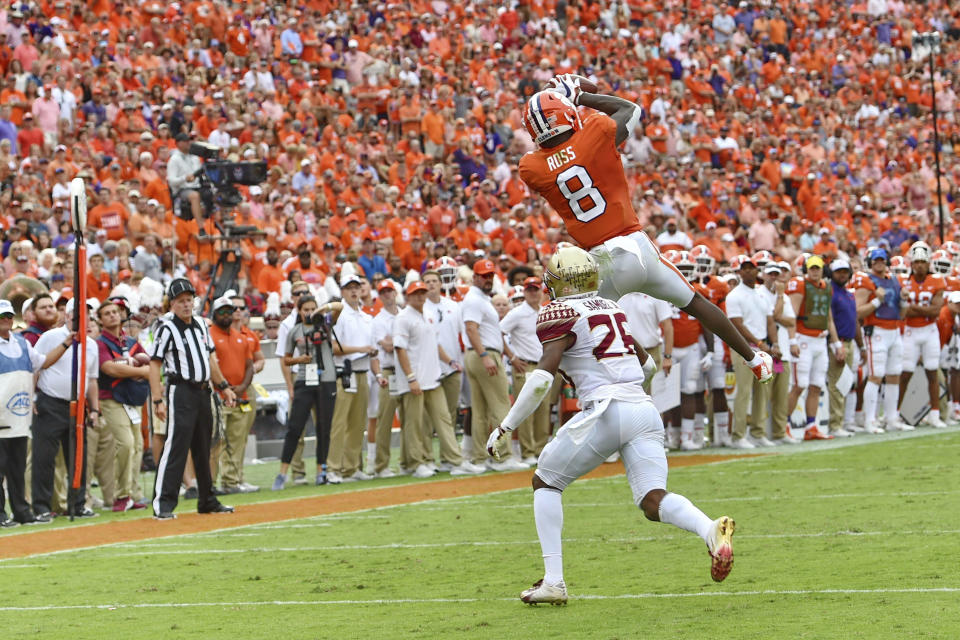 Clemson's Justyn Ross catches a pass over Florida State's Asante Samuel Jr. during the first half of an NCAA college football game Saturday, Oct. 12, 2019, in Clemson, S.C. (AP Photo/Richard Shiro)