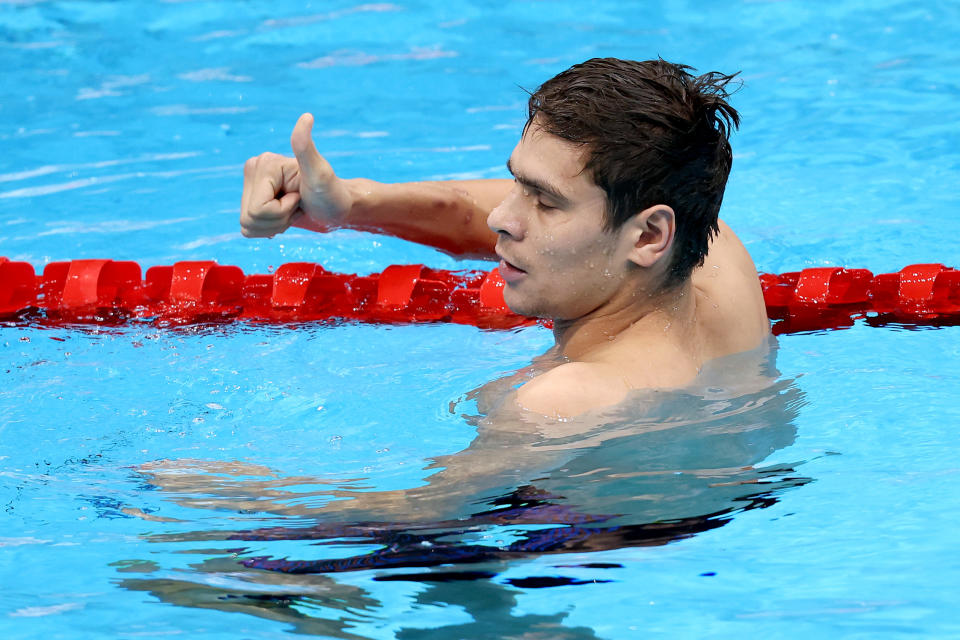 TOKYO, JAPAN - JULY 30: Evgeny Rylov of Team ROC reacts after winning the gold medal in the Men's 100m Backstroke Final on day four of the Tokyo 2020 Olympic Games at Tokyo Aquatics Centre on July 27, 2021 in Tokyo, Japan. (Photo by Tom Pennington/Getty Images)