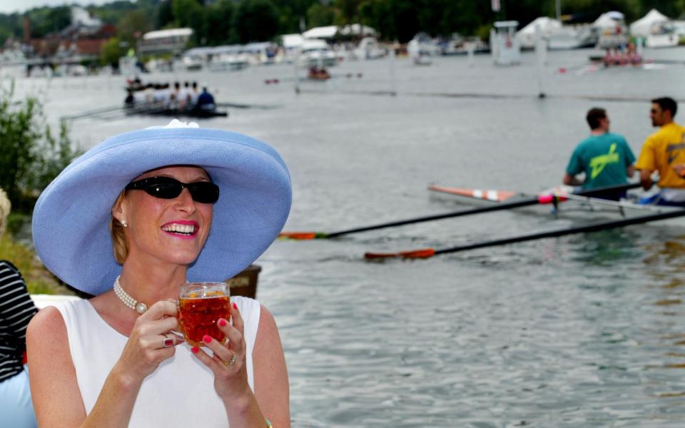 A spectator drinks Pimm's at the Henley Royal Regatta, 2002