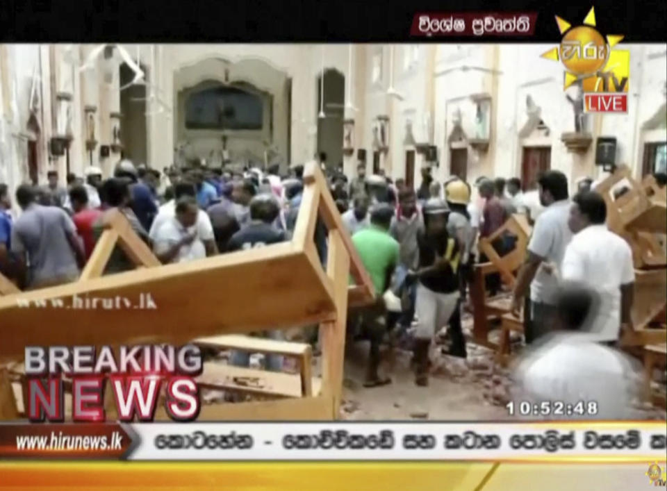 This image made from video provided by Hiru TV shows damage inside a church after a blast in Colombo, Sunday, April 21, 2019. Near simultaneous blasts rocked three churches and three hotels in Sri Lanka on Easter Sunday.(Hiru TV via AP)