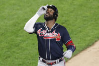 Atlanta Braves Marcell Ozuna reacts crossing the plate after hitting a three-run, home run during a baseball game against the New York Yankees, Tuesday, Aug. 11, 2020, in New York. (AP Photo/Kathy Willens)