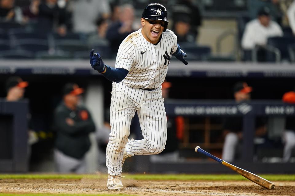 New York Yankees' Jose Trevino celebrates after hitting a single to drive in the winning run during the 11th inning of the team's baseball game against the Baltimore Orioles on Tuesday, May 24, 2022, in New York. The Yankees won 7-6. (AP Photo/Frank Franklin II)