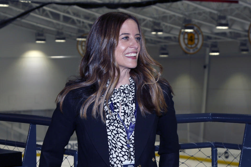 FILE - NWHL interim Commissioner Tyler Tumminia poses for a photo before a WNHL playoff hockey playoff game in Boston, Friday, March 26, 2021. The Premier Hockey Federation is more than doubling each teams’ salary cap to $750,000 and adding two expansion franchises next season in a bid to capitalize on the wave of attention women’s hockey traditionally enjoys following the Winter Olympics. “It’s an amazing investment by the ownership, and it really reaffirms the strength of their commitment to being a difference-maker in women’s hockey,” PHF Commissioner Ty Tumminia told The Associated Press.(AP Photo/Mary Schwalm, File)