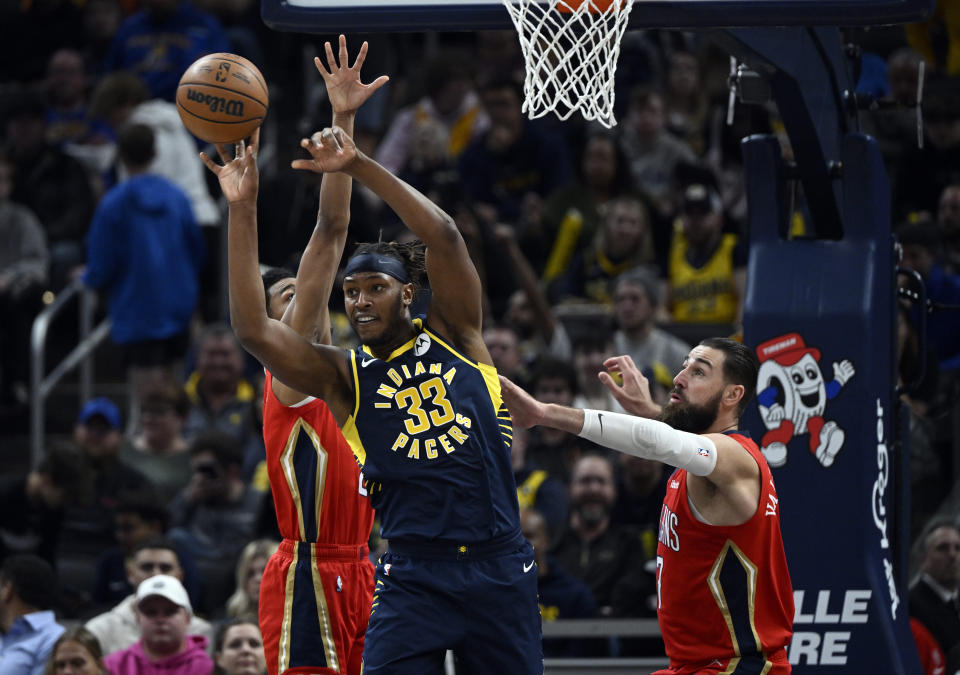 Indiana Pacers center Myles Turner (33) passes away the ball during the second quarter of an NBA Basketball game against the New Orleans Pelicans, Monday, Nov. 7, 2022, in Indianapolis, Ind. (AP Photo/Marc Lebryk)