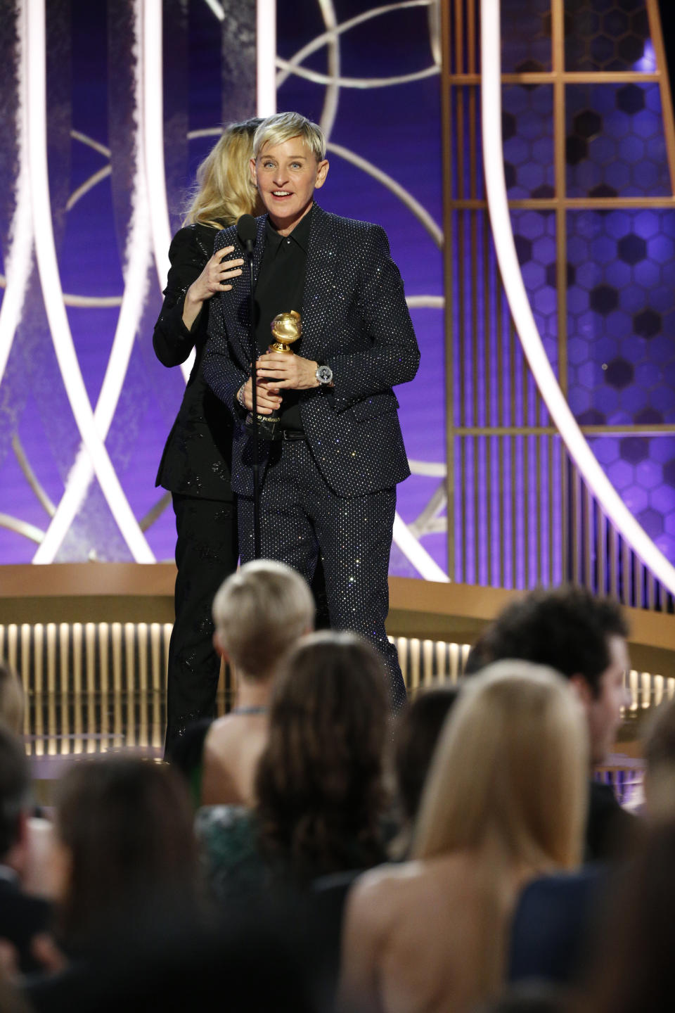 BEVERLY HILLS, CALIFORNIA - JANUARY 05: In this handout photo provided by NBCUniversal Media, LLC,  Ellen DeGeneres accepts the CAROL BURNETT AWARD presented by Kate McKinnon onstage during the 77th Annual Golden Globe Awards at The Beverly Hilton Hotel on January 5, 2020 in Beverly Hills, California. (Photo by Paul Drinkwater/NBCUniversal Media, LLC via Getty Images)