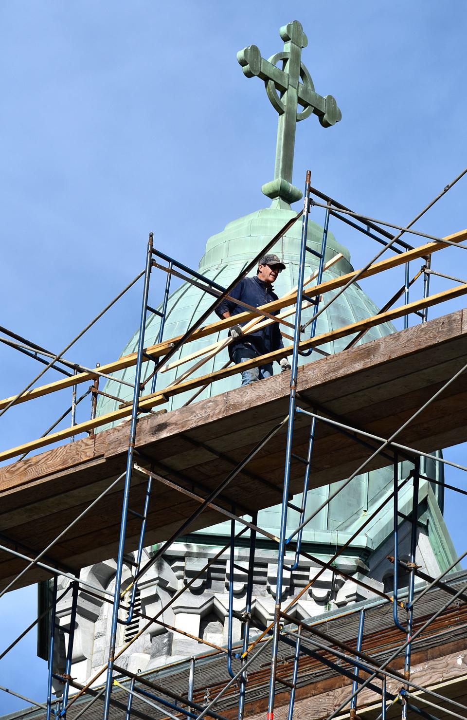 Roof repair work is being done at St. Anne's Church at South Main and Middle streets in Fall River on Friday, Nov. 17, 2023.