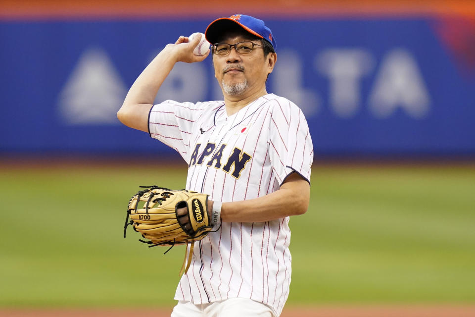 The Japanese consul-general in New York, Ambassador Mikio Mori, throws out a ceremonial first pitch before a baseball game between the New York Mets and the Colorado Rockies, Thursday, Aug. 25, 2022, in New York. (AP Photo/Frank Franklin II)