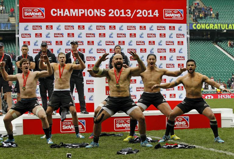 New Zealand celebrate with the Champions trophy after winning the Rugby Sevens Cup at the IRB Rugby Sevens series at Twickenham, on May 11, 2014