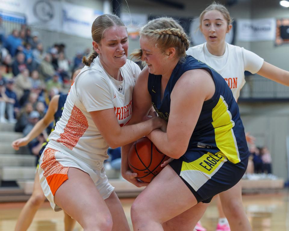 Brighton's Sophia Heady (left) and Hartland's Aubree Meyer (right) battle for a loose ball Thursday, Jan. 4, 2024.