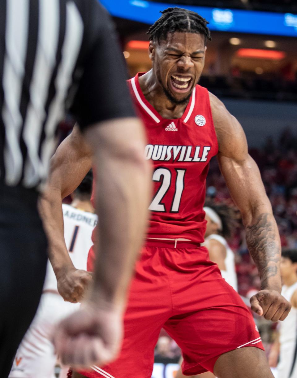 Louisville's Sydney Curry celebrates after scoring against Virginia during ACC action at the YUM Center. Curry lead all scorers with 24 points and 14 rebounds in the loss. March 5, 2022