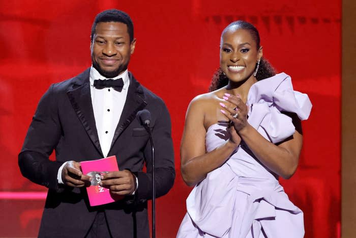 Jonathan Majors and Issa Rae onstage