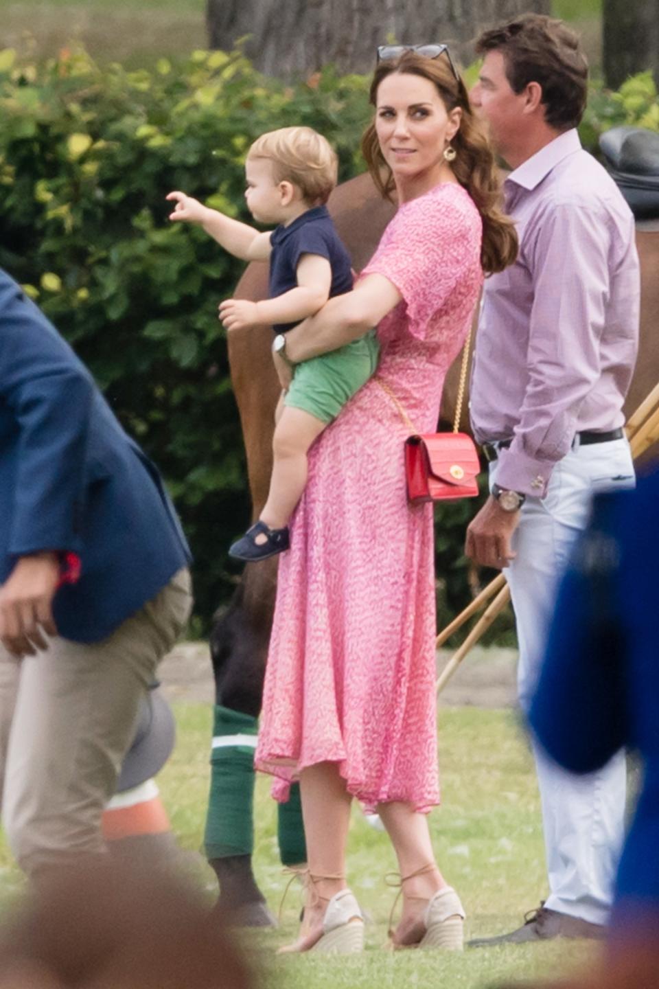 Kate Middleton stepped out with her family at <a href="https://people.com/royals/meghan-markle-kate-middleton-bring-kids-louis-archie-polo-match/" rel="nofollow noopener" target="_blank" data-ylk="slk:the King Power Royal Charity Polo Day;elm:context_link;itc:0;sec:content-canvas" class="link ">the King Power Royal Charity Polo Day</a> wearing a flowy pink midi dress accessorized with <a href="https://people.com/style/kate-middleton-meghan-markle-castaner-wedges/" rel="nofollow noopener" target="_blank" data-ylk="slk:her beloved Castañer espadrille wedges;elm:context_link;itc:0;sec:content-canvas" class="link ">her beloved Castañer espadrille wedges</a> and a red crossbody bag. <strong>Get the Look!</strong> All In Favor Dolman Plissé Midi Dress, $59; <a href="https://click.linksynergy.com/deeplink?id=93xLBvPhAeE&mid=1237&murl=https%3A%2F%2Fshop.nordstrom.com%2Fs%2Fall-in-favor-dolman-plisse-midi-dress%2F4998578&u1=PEO%2CShopping%3AEverythingYouNeedtoCopyKateMiddleton%E2%80%99sSummerStyle%2Ckamiphillips2%2CUnc%2CGal%2C7115494%2C201907%2CI" rel="nofollow noopener" target="_blank" data-ylk="slk:nordstrom.com;elm:context_link;itc:0;sec:content-canvas" class="link ">nordstrom.com</a> Moon River Raglan Puff Sleeve Dress, $103; <a href="https://www.amazon.com/MOON-RIVER-Womens-Raglan-Sleeve/dp/B07TKMM3ZC/ref=as_li_ss_tl?s=shopbop&ref_=sb_ts&linkCode=ll1&tag=poamzfkatemiddletonsummerstyle2019kphillips0719-20&linkId=2d663e76c404349fdda94e91ef285c5f&language=en_US" rel="nofollow noopener" target="_blank" data-ylk="slk:amazon.com;elm:context_link;itc:0;sec:content-canvas" class="link ">amazon.com</a> Cleobella Olivia Dress, $188; <a href="https://www.amazon.com/Cleobella-Womens-Olivia-Floral-X-Small/dp/B07RBFJYLQ/ref=as_li_ss_tl?s=shopbop&ref_=sb_ts&linkCode=ll1&tag=poamzfkatemiddletonsummerstyle2019kphillips0719-20&linkId=73e4721e12879a52a3cd37c084b7f744&language=en_US" rel="nofollow noopener" target="_blank" data-ylk="slk:amazon.com;elm:context_link;itc:0;sec:content-canvas" class="link ">amazon.com</a> BA&SH Gala Foil Print Midi Dress, $206.90 (orig. $345); <a href="https://click.linksynergy.com/deeplink?id=93xLBvPhAeE&mid=1237&murl=https%3A%2F%2Fshop.nordstrom.com%2Fs%2Fbash-gala-foil-print-midi-dress%2F5153036&u1=PEO%2CShopping%3AEverythingYouNeedtoCopyKateMiddleton%E2%80%99sSummerStyle%2Ckamiphillips2%2CUnc%2CGal%2C7115494%2C201907%2CI" rel="nofollow noopener" target="_blank" data-ylk="slk:nordstrom.com;elm:context_link;itc:0;sec:content-canvas" class="link ">nordstrom.com</a> House of Harlow 1960 X Revolve Meriem Dress, $248; <a href="http://www.anrdoezrs.net/links/8029122/type/dlg/sid/PEO,Shopping:EverythingYouNeedtoCopyKateMiddleton’sSummerStyle,kamiphillips2,Unc,Gal,7115494,201907,I/https://www.revolve.com/house-of-harlow-1960-x-revolve-meriem-dress/dp/HOOF-WD481/" rel="nofollow noopener" target="_blank" data-ylk="slk:revolve.com;elm:context_link;itc:0;sec:content-canvas" class="link ">revolve.com</a> Tularosa Elliott Dress, $248; <a href="http://www.anrdoezrs.net/links/8029122/type/dlg/sid/PEO,Shopping:EverythingYouNeedtoCopyKateMiddleton’sSummerStyle,kamiphillips2,Unc,Gal,7115494,201907,I/https://www.revolve.com/tularosa-elliot-dress/dp/TULA-WD788/" rel="nofollow noopener" target="_blank" data-ylk="slk:revolve.com;elm:context_link;itc:0;sec:content-canvas" class="link ">revolve.com</a>