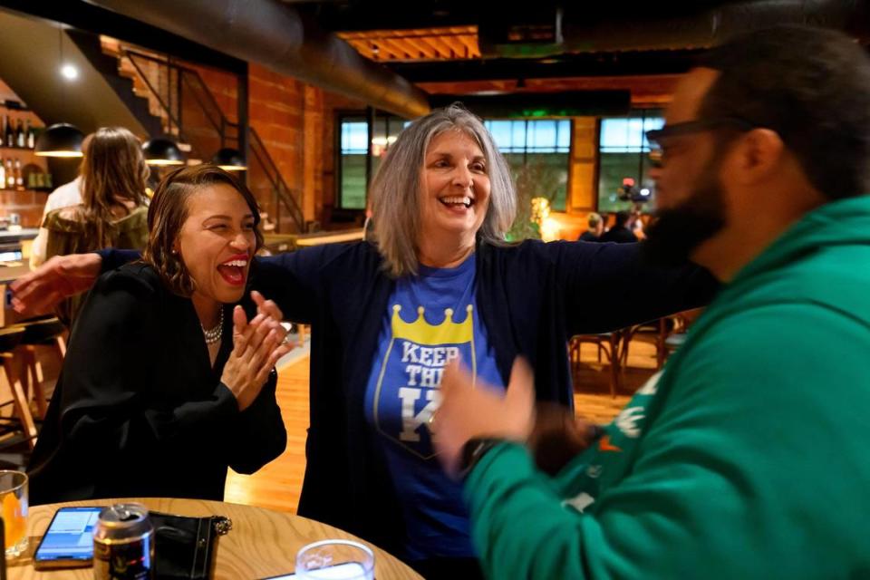 Megan Marshall, Vice Chair of the County Legislature, left, Becky Nace, chair of The Committee Against New Royals Stadium Taxes, center, and Tim Smith, campaign chairman, right, celebrate the defeat of the stadium tax proposal during the Vote “no” committee watch party at Green Dirt Farm, Tuesday, April 2, 2024.